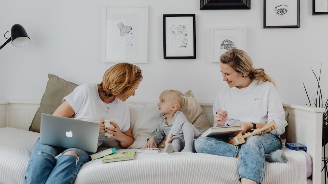 A mother and daughter enjoy a cozy bonding time at home, sharing laughs and love.